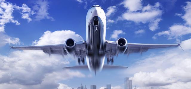 Airplane on a cloudy blue sky